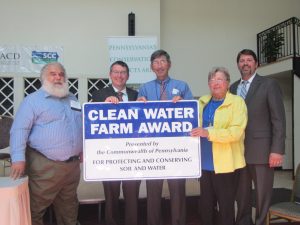 Left to right: PACD President Glenn Seidel, Acting Secretary of Environmental Protection Patrick McDonnell, C. Barclay Hoopes, Jr., Diana Hoopes, and Deputy Secretary of Agriculture Greg Hostetter. The Hoopes were presented with the Clean Water Farm Award on July 27, 2016. They were nominated by the Chester County Conservation District.